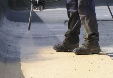 Coating systems over Cedar Rapids spray foam roof systems